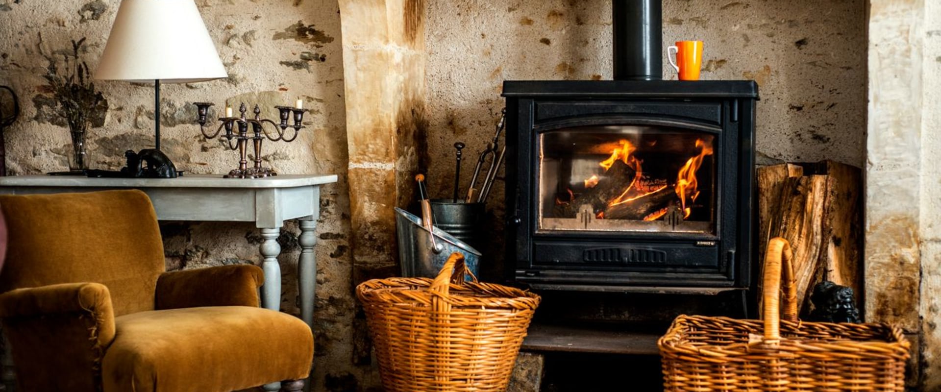 Which heats better wood stove or fireplace?