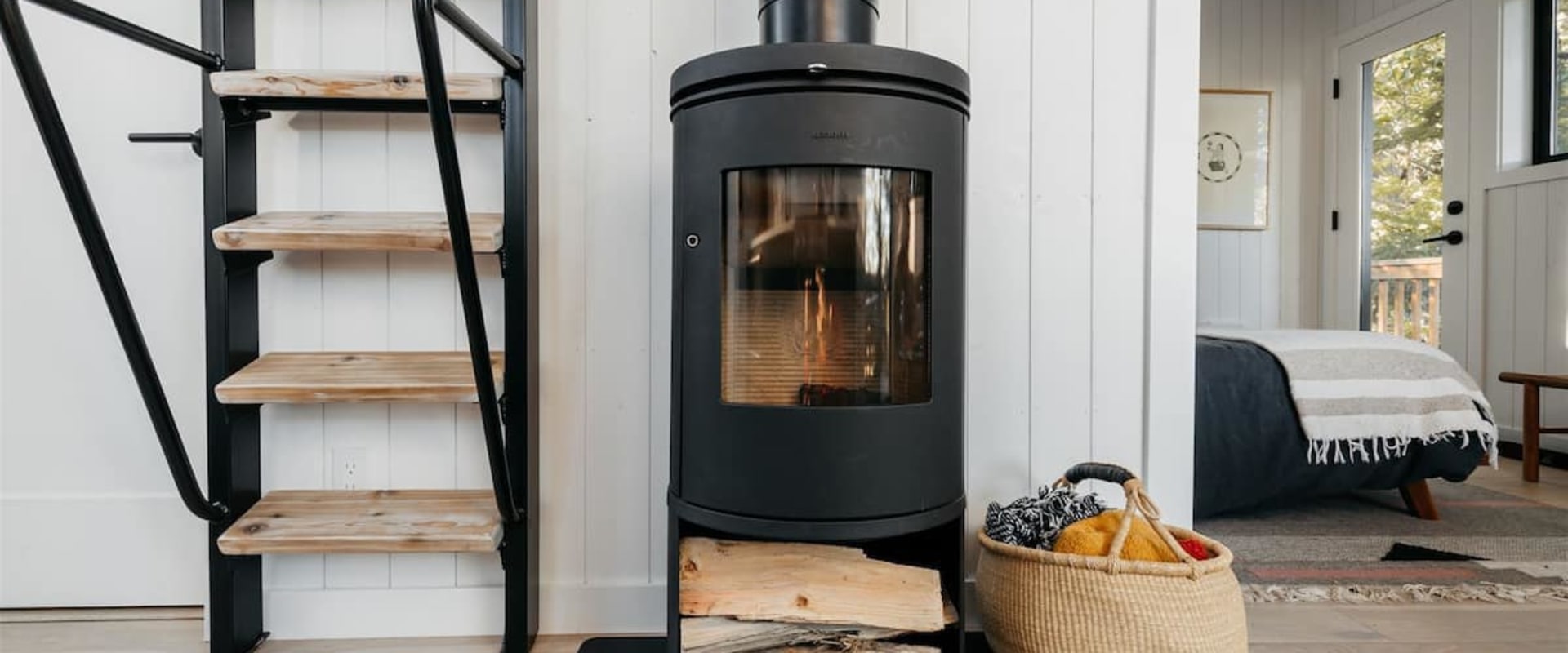 Can a wood stove heat a two story house?
