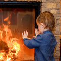 What produces more heat gas or wood fireplace?